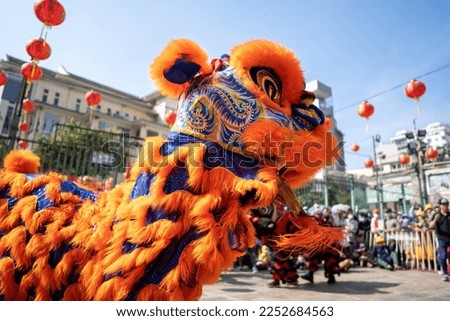 Dragon and lion dance show in chinese new year festival (Tet festival ), lion Dance - dragon and lion dance street performances in Vietnam. Holidays and celebrations concept. Selective focus.
