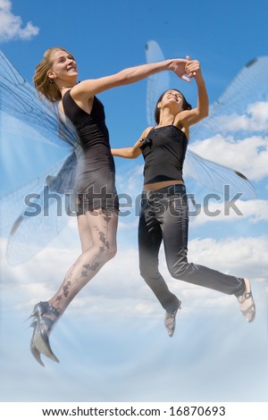 'Dragonfly' women laugh with cloudy sky background. Focus point is on the faces.
