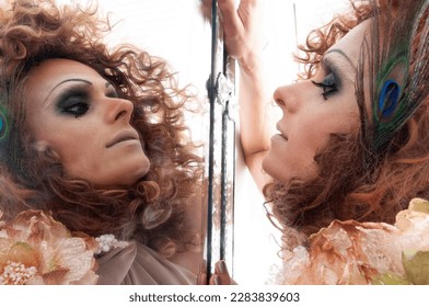 a dragqueen admiring herself in the mirror