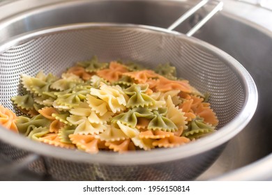 Drain The Cooked Pasta With A Metal Strainer