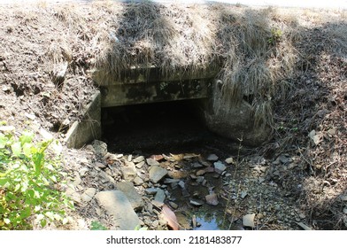 Drain Culvert Under Roadway With Water