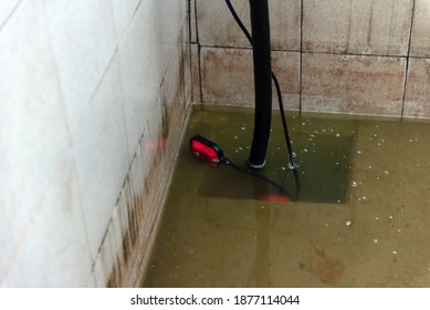 The drain pump in a dirty water pool.