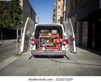 Drain Service Van At Work With Open Rear Doors. Pump Hydraulic Motorpump Visible