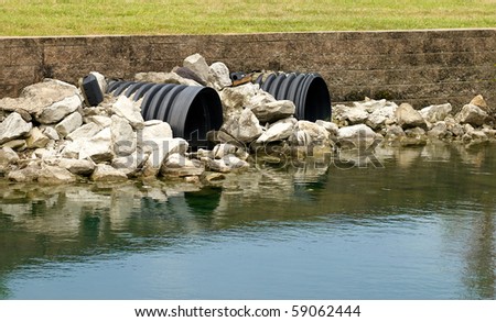 Drainage pipes going into a lake