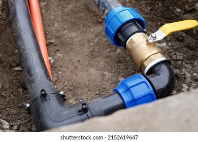 Drainage system with connector and faucet for sewerage. Irrigation system for vegetable garden concept