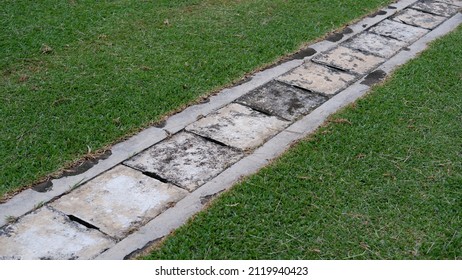 A Drainage System For Storm Water Drainage In Side A Pedestrian Sidewalk