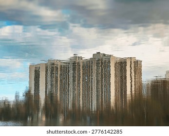 Dramatic abstract building reflected on spring lake landscape