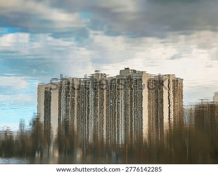 Dramatic abstract building reflected on spring lake landscape