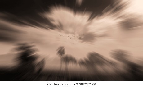 Dramatic abstract nature background with radial zoom blur effect on flying birds and village trees in sepia tone