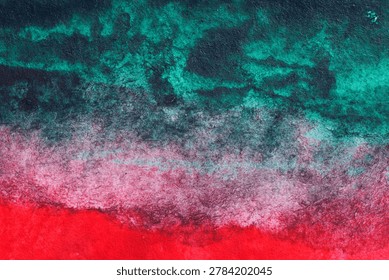 Dramatic abstract watercolor texture with dark teal, red, pink, and black layered pigment on fibrous paper, ideal for bold backgrounds and modern creative design.