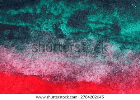 Dramatic abstract watercolor texture with dark teal, red, pink, and black layered pigment on fibrous paper, ideal for bold backgrounds and modern creative design.