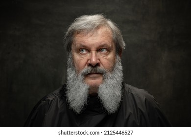 Dramatic Actor. Half-length Portrait Of Emotional Senior Bearded Man Getting Beard Grooming Isolated On Dark Vintage Background. Concept Of Emotions, Fashion, Beauty, Self-reinvention