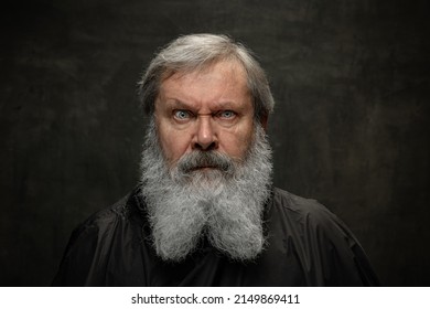 Dramatic Actor. Half-length Portrait Of Emotional Senior Bearded Man Getting Beard Grooming Isolated On Dark Vintage Background. Concept Of Emotions, Fashion, Beauty, Self-reinvention