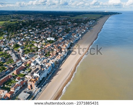 Dramatic aerial view of the popular Suffolk coastal town of Aldeburgh. The expansive beach and the distant Sizewell B nuclear plant can be seen on the horizon.