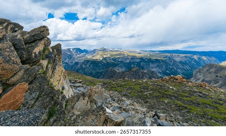Dramatic Alpine Vista from Beartooth Pass Summit in Montana and Wyoming - a high mountain pass in the Rocky Mountains, it's known for its stunning scenery, glacial lakes, and rugged mountain peaks.