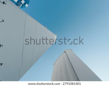 Dramatic architectural perspective of tall modern hotel towers showing immense scale and geometry against the sky in Acapulco, Mexico.