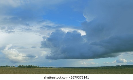 Dramatic and AweInspiring Cloud Formation Over Fields Creating a Stunning Scene in Nature