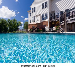 Dramatic Back Yard Swimming Pool And Garden Behind Modern Single Family Home