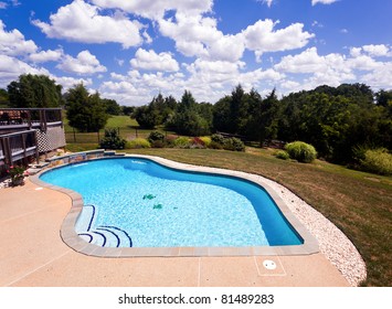 Dramatic Back Yard Swimming Pool And Garden Behind Modern Single Family Home