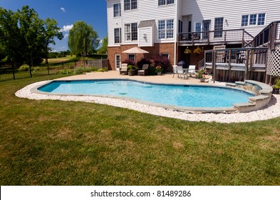 Dramatic Back Yard Swimming Pool And Garden Behind Modern Single Family Home