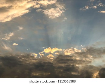 Dramatic backdrop of sky and clouds with the sun shining, sky background, cloudscape concept