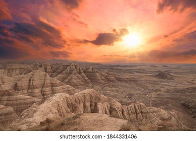 A Dramatic And Beautiful Sunset Falls Over The Painted Rocks Of Badlands National Park In South Dakota, United States, No People