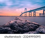 Dramatic beautiful sunset landscape over Claiborne Pell Newport Bridge, a modern tolled suspension bridge across Narragansett Bay, connecting Newport  Jamestown, Rhode Island