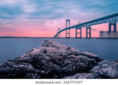 Dramatic beautiful sunset landscape over Claiborne Pell Newport Bridge, a modern tolled suspension bridge across Narragansett Bay, connecting Newport  Jamestown, Rhode Island
