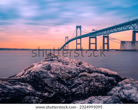Dramatic beautiful sunset landscape over Claiborne Pell Newport Bridge, a modern tolled suspension bridge across Narragansett Bay, connecting Newport  Jamestown, Rhode Island