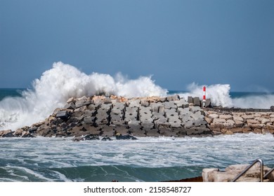 A Dramatic Big Sea Waves Splashing On Stone Breakers During A Stormy Day