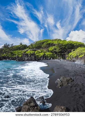 Dramatic Black Sand Beach with Volcanic Rocks and Lush Green Cliffs Under Wispy Cirrus Clouds, Maui, Hawaii, USA