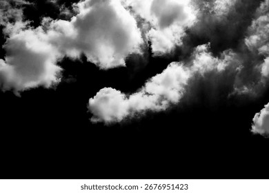 Dramatic black and white clouds in a moody sky.