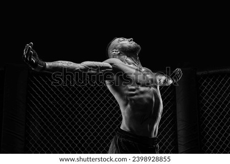 The dramatic black white image of the MMA fighter. Photography in a real octagon. Brutal fighter. Mixed media