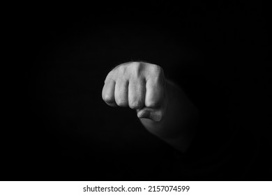 Dramatic black and white image of Oncoming Fist emoji isolated on black background