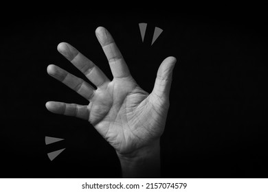 Dramatic Black And White Image Of Waving Hand Emoji Isolated On Black Background