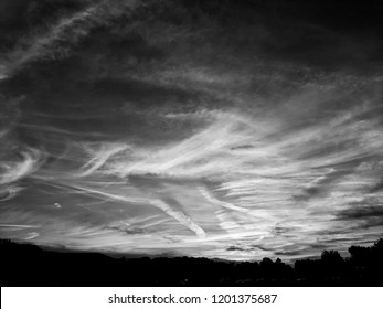 Dramatic black and white landscape with painterly clouds