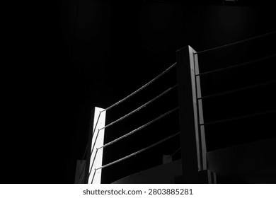 Dramatic Black and White Nautical Rope Railing with Wooden Posts