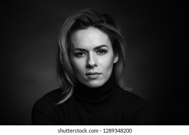 Dramatic Black And White Portrait Of A Beautiful Woman On A Dark Background