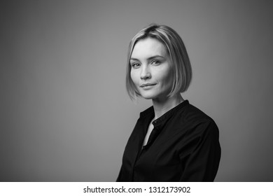 Dramatic Black And White Portrait Of A Beautiful Woman On A Dark Background