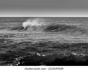 Dramatic black and white rolling waves at the beach, Marseillan Plage, Hérault, France