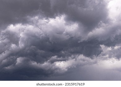 Dramatic black and white sky before a thunderstorm. Heavenly landscape. Cold Weather. Rainy season. Wrath of heaven. God is angry. Thunder and lightning. Beautiful stormy clouds.