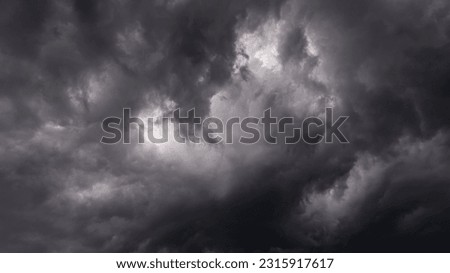 Dramatic black and white sky before a thunderstorm. Heavenly landscape. Cold Weather. Rainy season. Wrath of heaven. God is angry. Thunder and lightning. Beautiful stormy clouds.