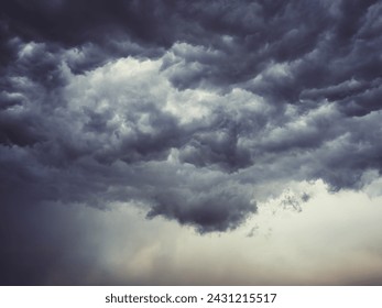 Dramatic blue sky with clouds. Spooky abstract background pattern texture. Horror, Halloween, evil, armagedon, apocalypse concept.