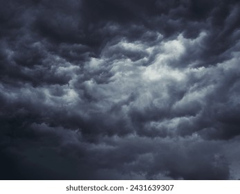 Dramatic blue sky with clouds. Spooky abstract background pattern texture. Horror, Halloween, evil, armagedon, apocalypse concept.