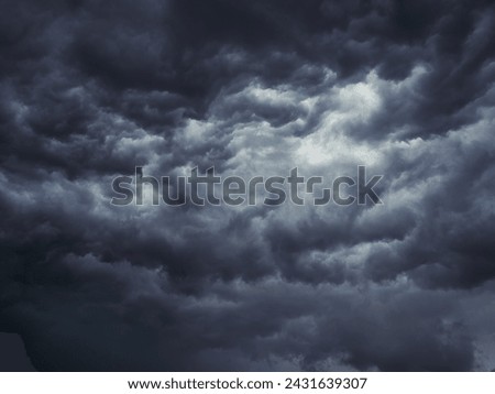Dramatic blue sky with clouds. Spooky abstract background pattern texture. Horror, Halloween, evil, armagedon, apocalypse concept.