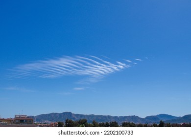 dramatic blue sky landscape with small gusty cloud