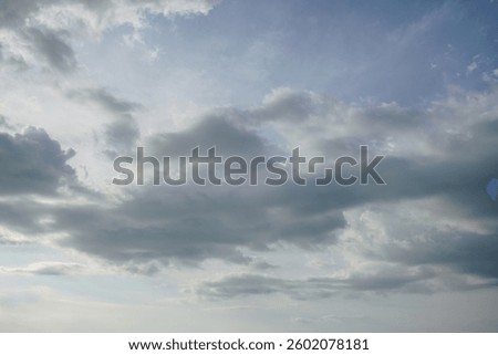 Dramatic blue sky with layered white and gray clouds for nature background, weather forecast, and climate conservation concept