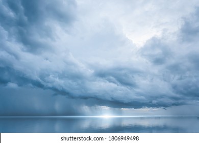Dramatic blue sky at the sea with clouds reflection in water, Dark color, Ocean storm