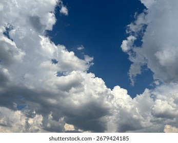 Dramatic blue sky with sun rays breaking through the clouds. A powerful and hopeful scene, perfect for themes of freedom, inspiration, and new beginnings.

