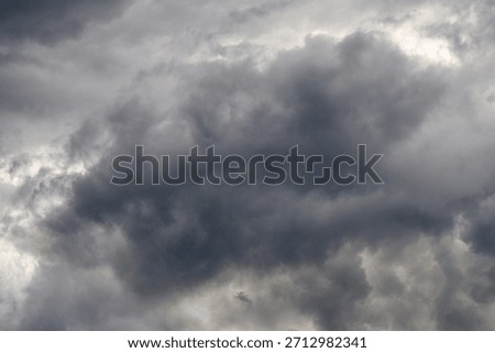 Dramatic and Chaotic Clouds Are Forming Amidst an Ominous Stormy Sky Looming Overhead